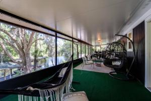 a room with a hammock and a large window at S'more Fun in Middleburg +42 photos