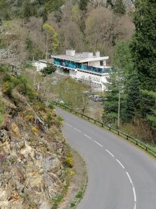 a building on the side of a road at La CABANE AUX ECREVISSES - LES PIEDS DANS L'EAU in Châteauneuf-les-Bains +7 photos
