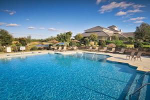 a large pool with blue water in a house at Club Wyndham Dye Villas in North Myrtle Beach