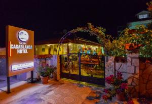 a restaurant with a sign in front of a building at Casablanca Hotel in Dalyan