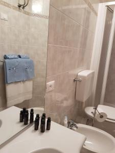 a bathroom with a sink and a toilet at Casa Mafalda in Corniglia +6 photos