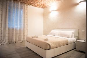 Krevet ili kreveti u jedinici u okviru objekta Aris Appartamento Torino