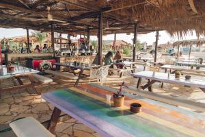 a group of tables and chairs in a restaurant at Sayadeen Village - Red Sea Riviera in Nuweiba