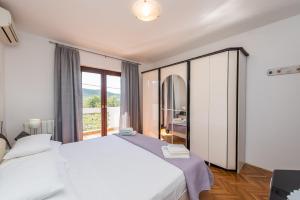 Ένα ή περισσότερα κρεβάτια σε δωμάτιο στο Stedi Apartment