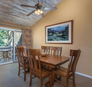 a dining room with a table and chairs and a ceiling fan at Club Wyndham Flagstaff in Flagstaff