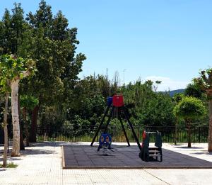 a playground with a camera on a tripod at Casa Maria in Olivenza