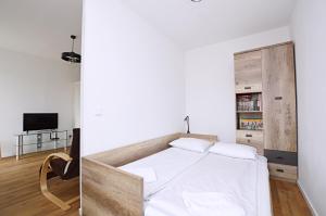 Televízia a/alebo spoločenská miestnosť v ubytovaní Seaside Studio Apartment Dworska