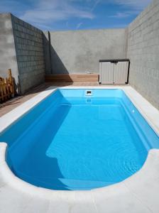 a large blue swimming pool in a building at Nuestras Estrellas in Cabreros del Monte
