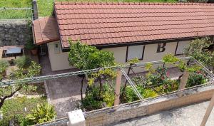an overhead view of a house with a garden at Apartments Peranovic in Kotor