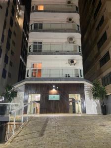 a white building with a staircase in front of it at Hotel Imperador in Santos