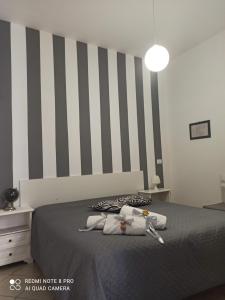 Postel nebo postele na pokoji v ubytování Sicilia bedda