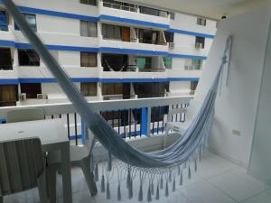 a hammock on the balcony of a cruise ship at Karey Apartamentos By Danp in Santa Marta