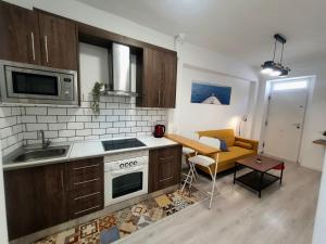 Kuchyň nebo kuchyňský kout v ubytování Apartamento moderno y acogedor.