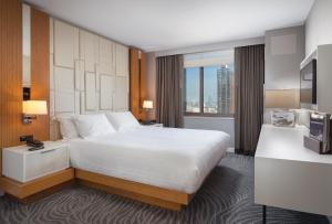 a hotel room with a large bed and a window at Club Wyndham Midtown 45 in New York +58 photos