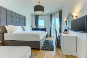 Hotel Riva Kaštela with swimming pool客房内的一张或多张床位