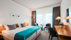 Rúm í herbergi á Dorint Hotel Dresden