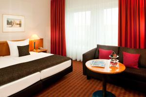 Rúm í herbergi á Dorint Hotel Dresden