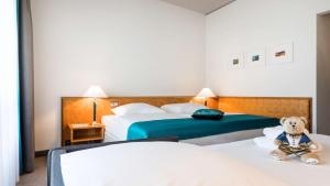 Rúm í herbergi á Dorint Hotel Dresden
