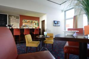 TV a/nebo společenská místnost v ubytování Livenwork Hotel & CoWorking GVZ Ingolstadt