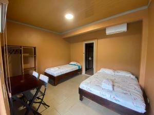 Postelja oz. postelje v sobi nastanitve Hotel Ticozuma