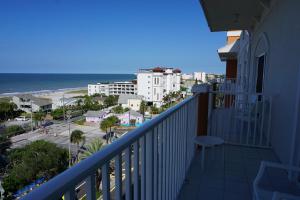 a balcony with a view of the beach and buildings at Madeira Bay Resort I by Travel Resort Services in St Pete Beach
