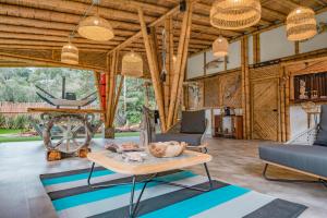 an open living room with a table and chairs at BubbleSky Glamping 15 min from Medellin in Rionegro