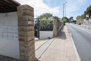 a gate on the side of a road at Mont des Olives - Cap D'ail- app4 in Saint-Antoine