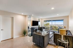 an open living room with a view of a city at I Only Have Eyes for You in Newport Beach