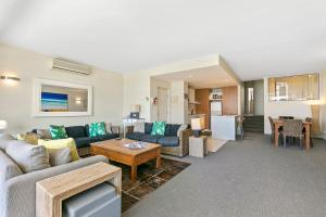 a living room with a couch and a table at Apartment 20 Kalimna in Lorne