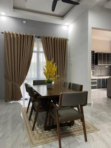 Billede fra billedgalleriet på afza Homestay Paka B i Paka