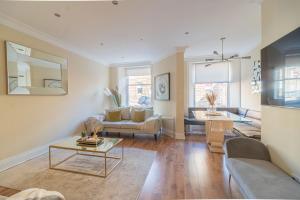 a living room with a couch and a table at Large Blythswood Residence in Glasgow