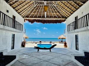 a view of the beach from the patio of a villa at Casa Amor Pto Morelos in Puerto Morelos