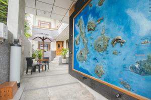 a mural of a world on the wall of a restaurant at Hotel Palace Galapagos in Puerto Ayora