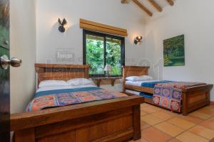 Ένα ή περισσότερα κρεβάτια σε δωμάτιο στο Fincas Panaca JAGÜEY 21 Grupo VIP