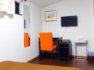 TV a/nebo společenská místnost v ubytování Guesthouse Bell Fushimi