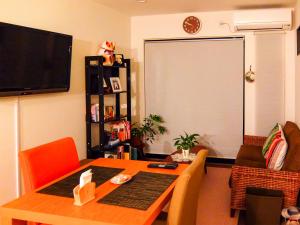 TV a/nebo společenská místnost v ubytování Guesthouse Bell Fushimi