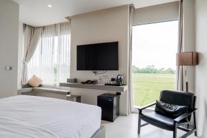 TV a/nebo společenská místnost v ubytování Doowall Hotel