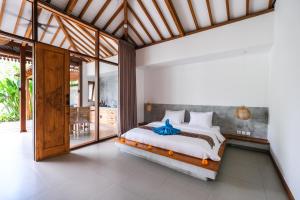 Letto o letti in una camera di Molokai Suites