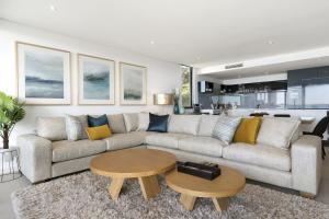 a living room with a couch and a table at Lorne Chalet Apartment 38 in Lorne