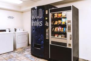 a large black refrigerator with food in it at Key Inn Macedonia in Macedonia