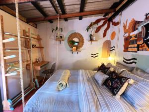 Postel nebo postele na pokoji v ubytování 13 Cielos Hostel & Coworking