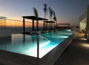 Bazén v ubytování Santa Marta Condominio Reserva del Mar Playa Salguero frente al Mar nebo v jeho okolí
