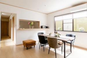 a dining room with a table and chairs at Terrace Kyobate （Vacation house in Nara） in Nara +27 photos