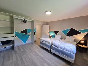 Postel nebo postele na pokoji v ubytování Le Gîte du Petit Béret