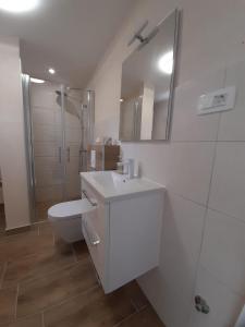 Phòng tắm tại Rooms & Apartment Lasta