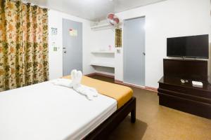Кровать или кровати в номере Boracay Morning Beach Resort