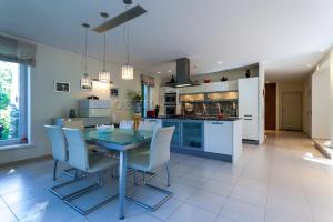 a kitchen and dining room with a table and chairs at Villa in Tallinn near beach in Tallinn