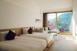 Cama ou camas em um quarto em Muni Kyoto