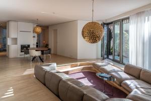 a living room with a couch and a table at Luxury Apartment Berlin Mitte in Berlin