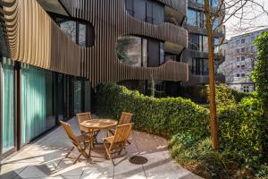 a table and chairs sitting in front of a building at Luxury Apartment Berlin Mitte in Berlin